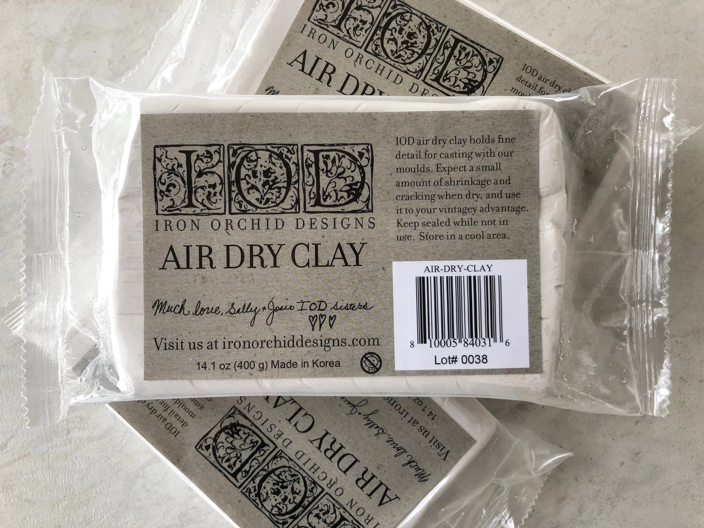Package of Iron Orchid Designs air dry clay on a light background