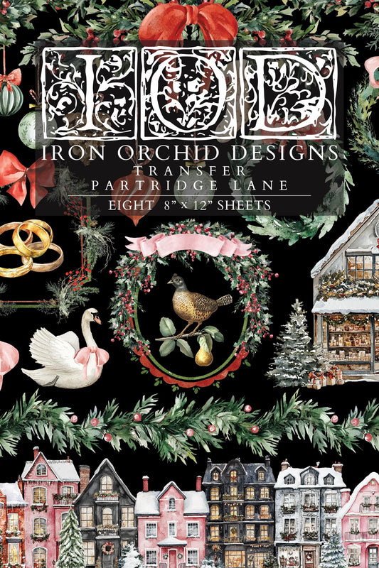 Front cover of Iron Orchid Designs transfer with Christmas-themed designs on a black background