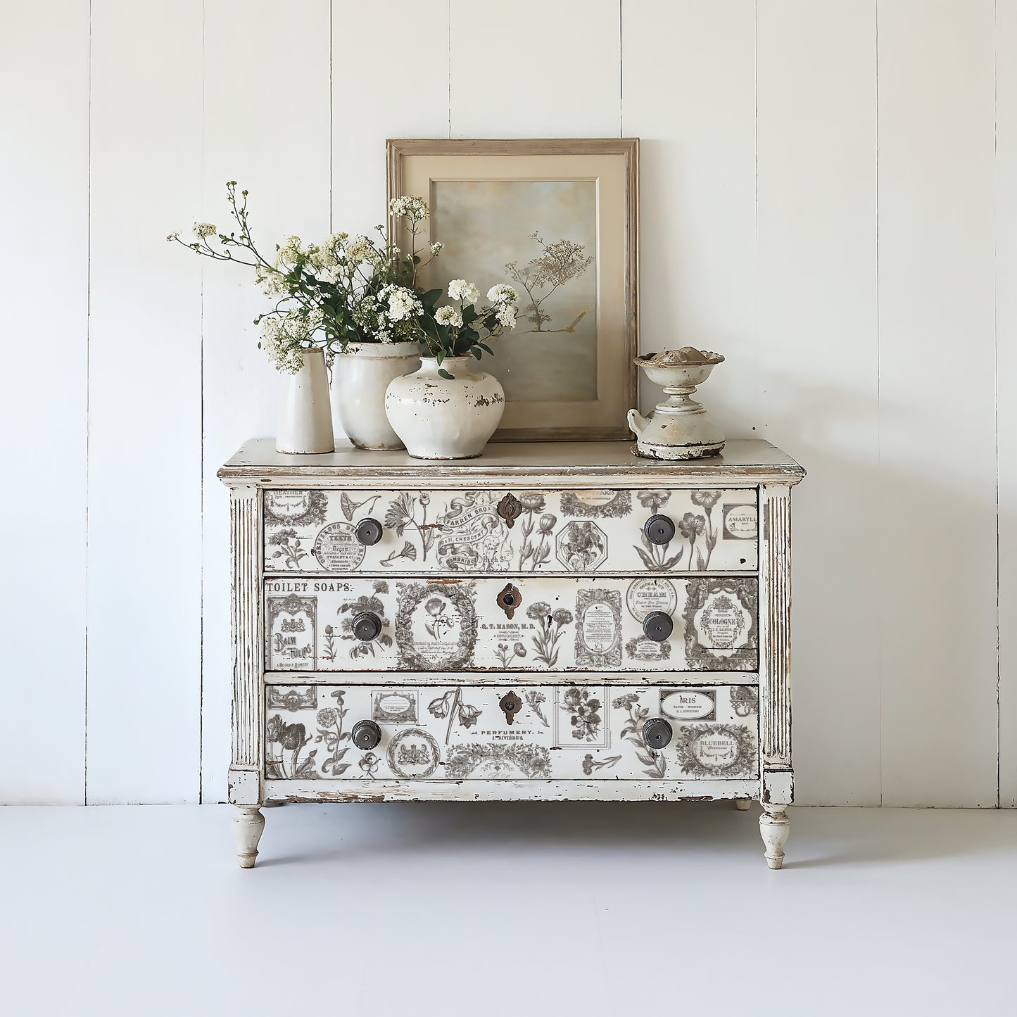 Example of floriography inlay on white dresser drawer in white room