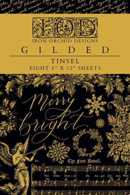 Packaging for Tinsel gilded Christmas transfer sheets designed by Iron Orchid Designs, featuring holiday motifs and decorative text.