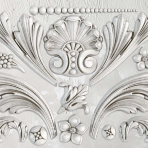 A close-up image of a decorative Acanthus scroll pattern on a silicone mould.