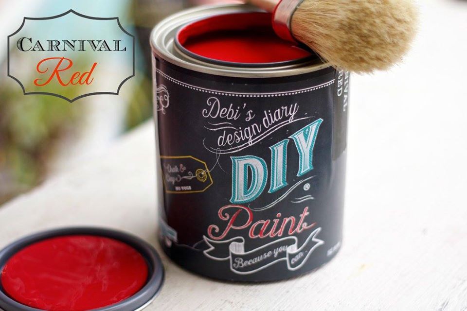 A can of Carnival Red DIY paint with a brush next to it, indicating a red color for the paint.