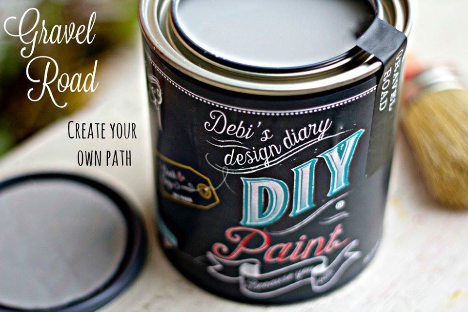 An open can of Gravel Road grey chalk paint for DIY furniture restoration.