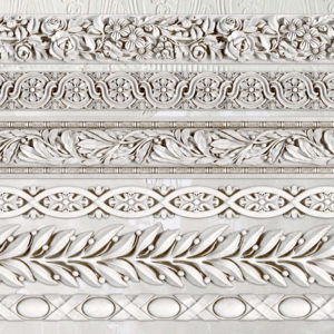 A mould made up of various decorative borders with intricate designs.