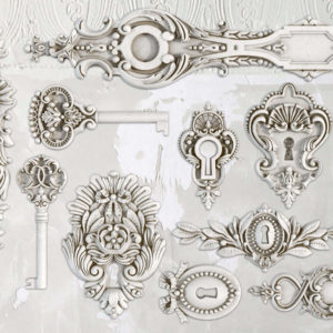 A decorative mold featuring various lock and key designs with ornate detailing.