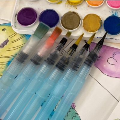 6 watercolor brushes filled with water