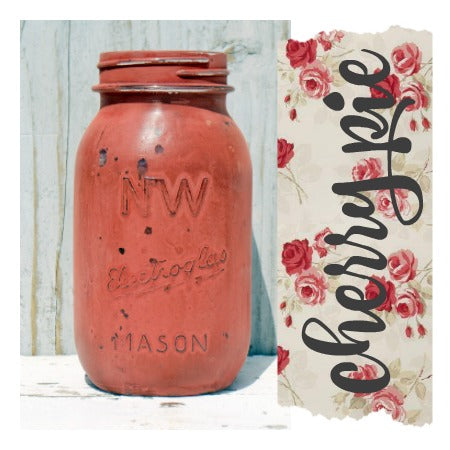A vintage jar lpainted in the shade Cherry Pie from 'Sweet Pickins' with a floral pattern background,.
