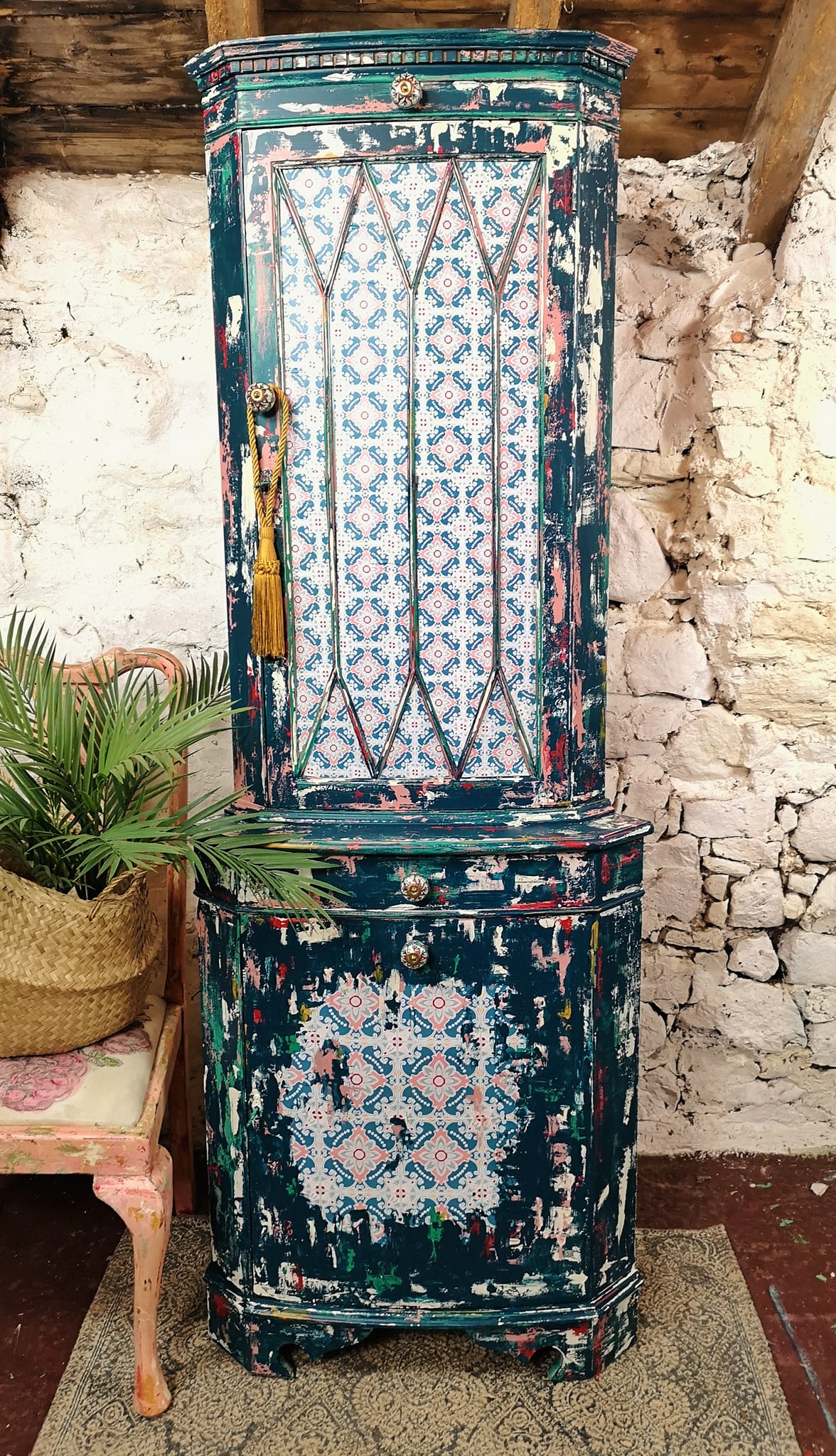 A refurbished cupboard featuring the Lotus Love decoupage paper on the front door.