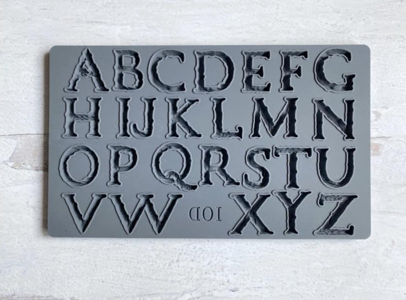 A gray-colored mould called "Victoria" with uppercase letter designs from A to Z, including the brand's initials 'IOD'.