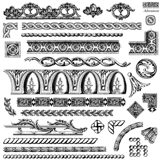 A collection of various decorative trimmings on a large, IOD stamp called "Adornment" used for crafting and stamping.