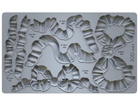 A 6"x10" silicone mould from IOD with bow shapes and their approximate measurements