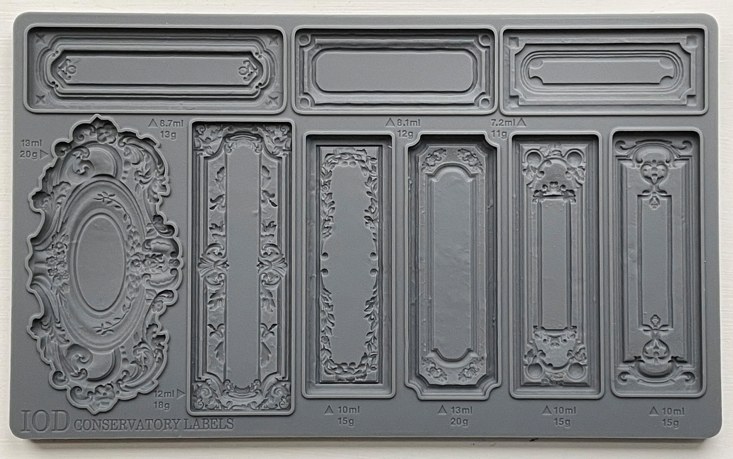 A gray-colored Decor Mould called 'Conservatory Labels" with various label designs for crafting.