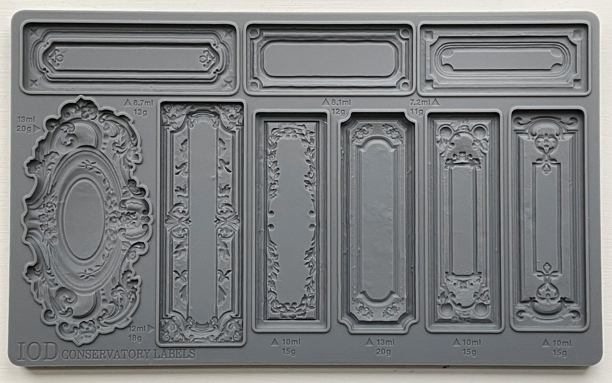 A gray-colored Decor Mould called 'Conservatory Labels" with various label designs for crafting.
