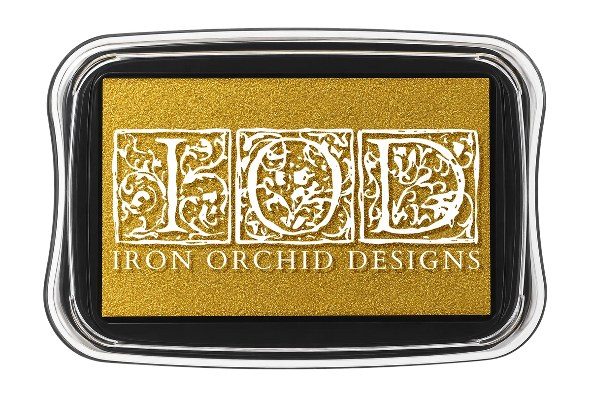 Iron Orchid Designs ink pad in a rectangular case with a gold ink bed and white ornate lettering that reads 'IOD' and 'IRON ORCHID DESIGNS'.