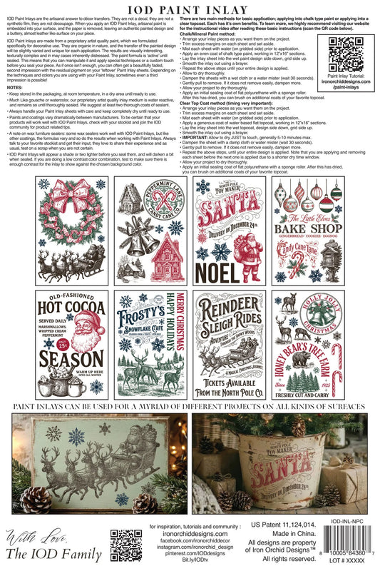 A product information sheet for IOD Paint Inlay featuring multiple holiday-themed printed designs such as Santa, reindeer, wreaths, and seasonal text, plus a small example application photo at the bottom.