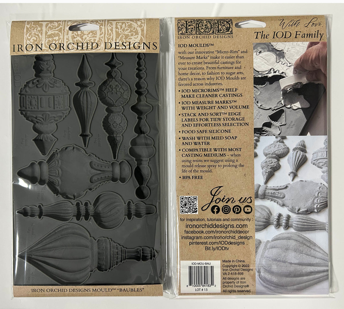 Iron Orchid Designs 'Baubles' silicone mold in its original retail packaging, showing the dark gray silicone mold on the left and the product information card on the right.