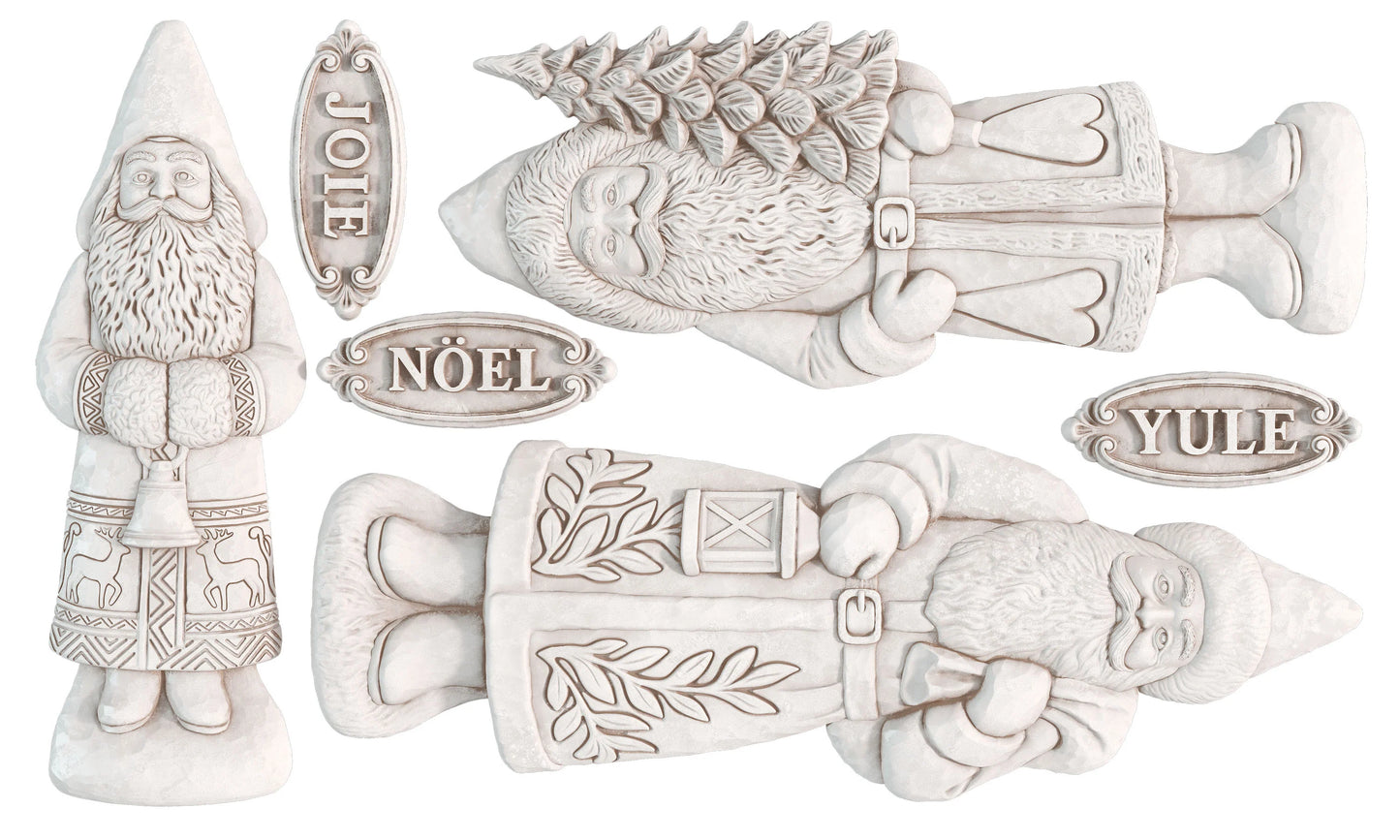 Four white holiday Belsnickel figurine castings, including one holding a Christmas tree and three with nameplates reading JOY, NOÉL, and YULE.