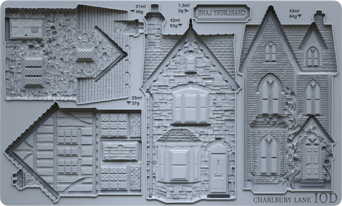 A gray silicone mould featuring detailed embossed house designs and architectural sections, with a printed label including 'CHARLBURY LANE'.