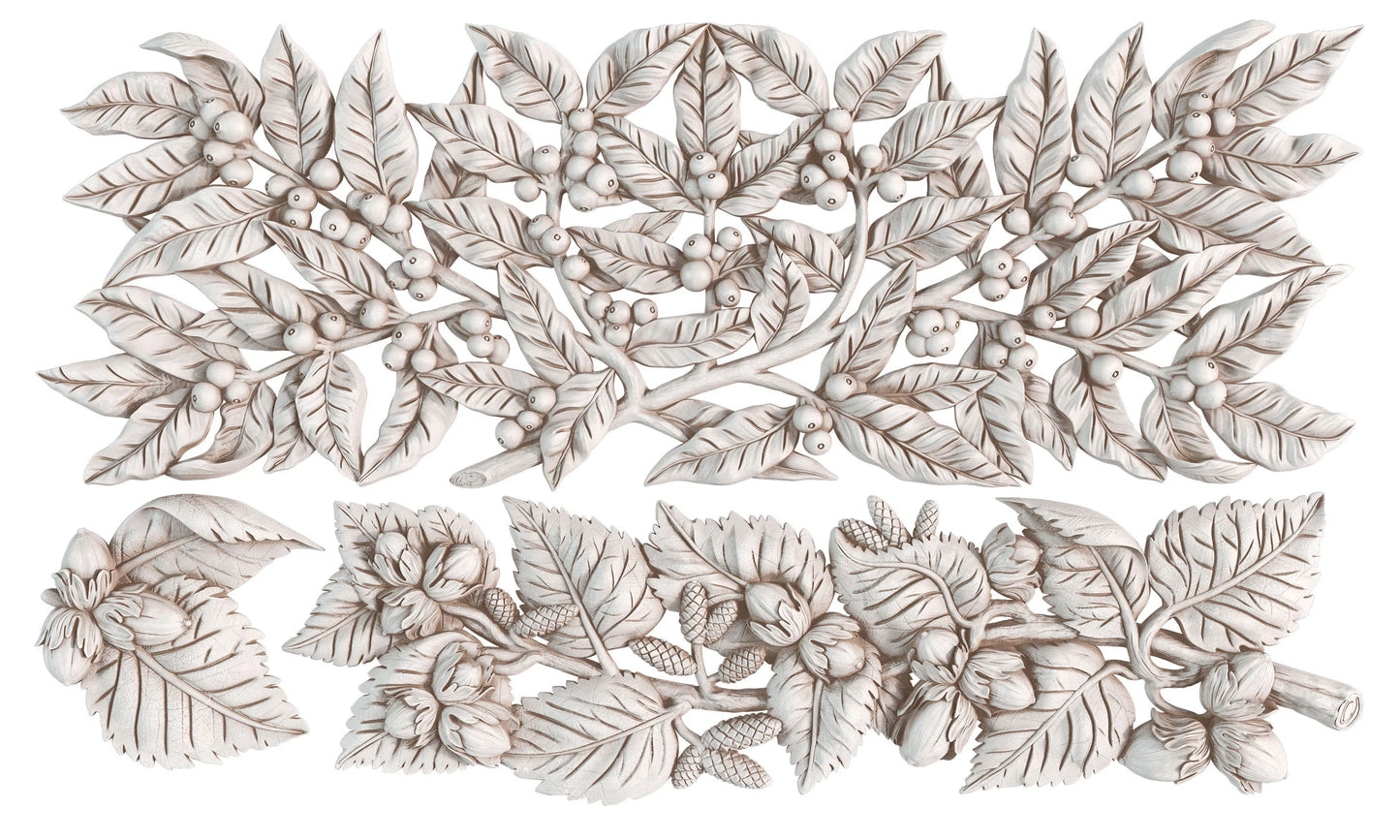 A set of air dried clay castings featuring detailed botanical leaf and berry motifs, arranged on a plain white background.