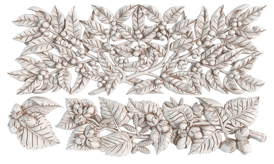 A set of air dried clay castings featuring detailed botanical leaf and berry motifs, arranged on a plain white background.