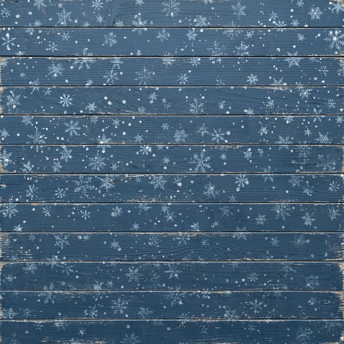 A square decorative panel or backdrop featuring a distressed blue wood plank design with scattered white snowflake stampings and snowflurries across the surface.