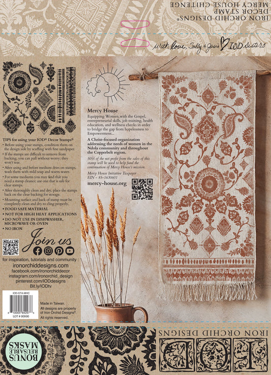 Back cover of IOD stamp packaging with intricate patterns on a rug and instructions on the side.