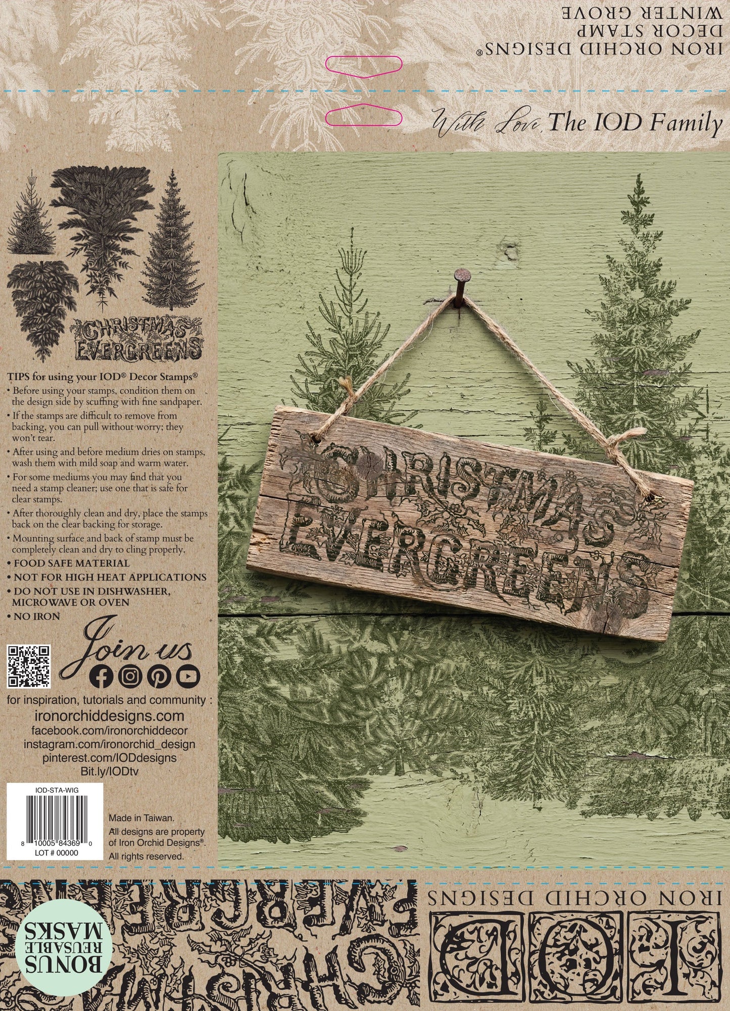 Back packaging of a 'Christmas Evergreen' rub-on transfer design from Iron Orchid Designs, featuring a rustic wooden hanging sign with the words 'CHRISTMAS EVERGREEN' over a green pine forest background, alongside product details and application examples.