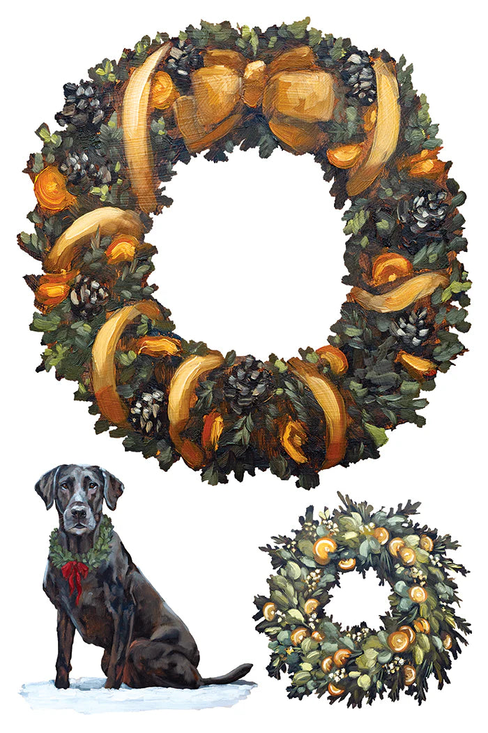 A transfer paper with a holiday wreath design shown on a white background, with a large wreath at the top, a small dog wearing a green garland at bottom left, and a smaller wreath at bottom right.