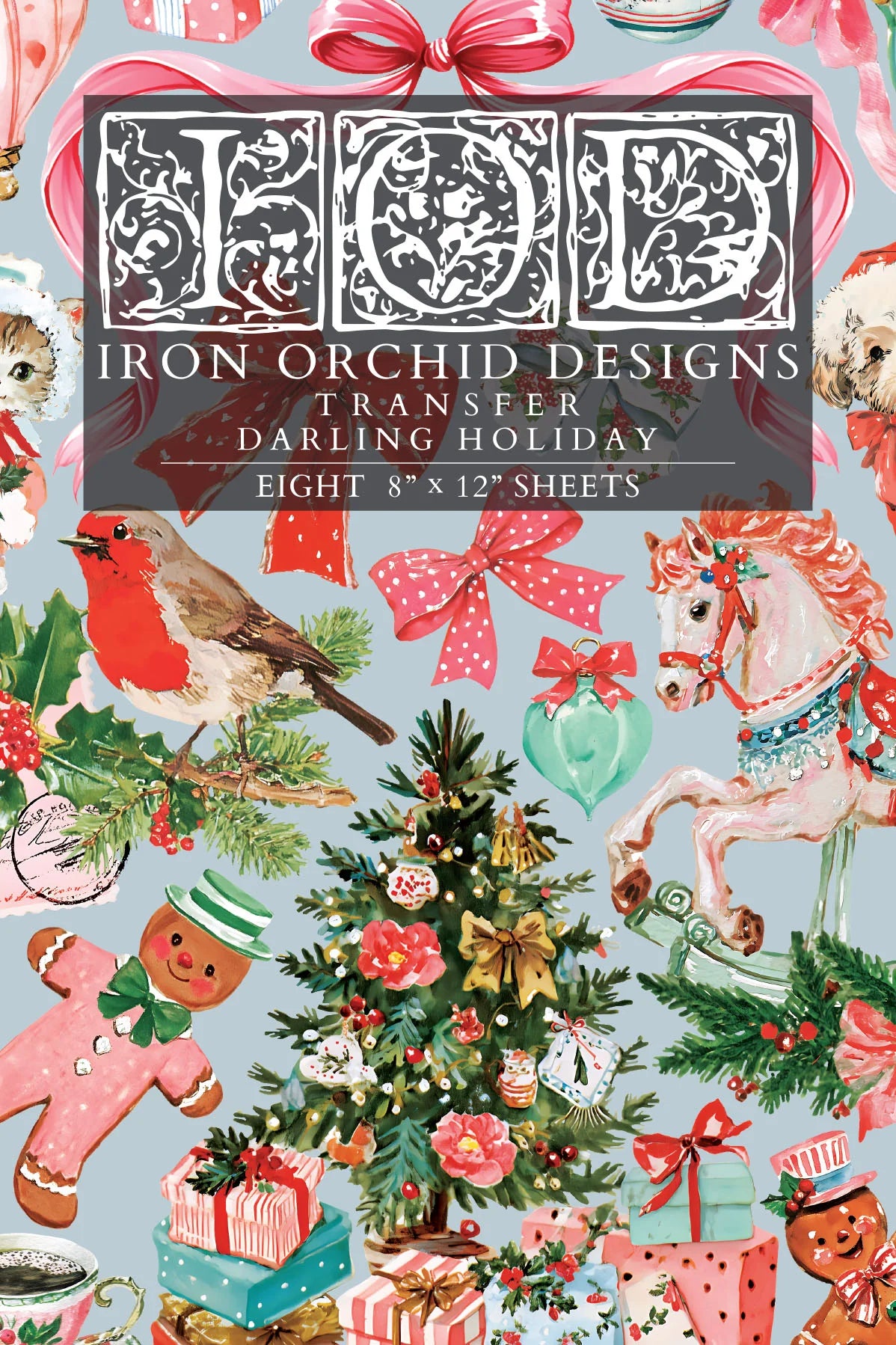 A Christmas-themed transfer paper cover featuring a busy holiday pattern with a robin, carousel horse, ornaments, gifts, gingerbread men, bows, and a central title panel reading 'Iron Orchid Designs Transfer Darling Holiday' and 'Eight 8" x 12" sheets'