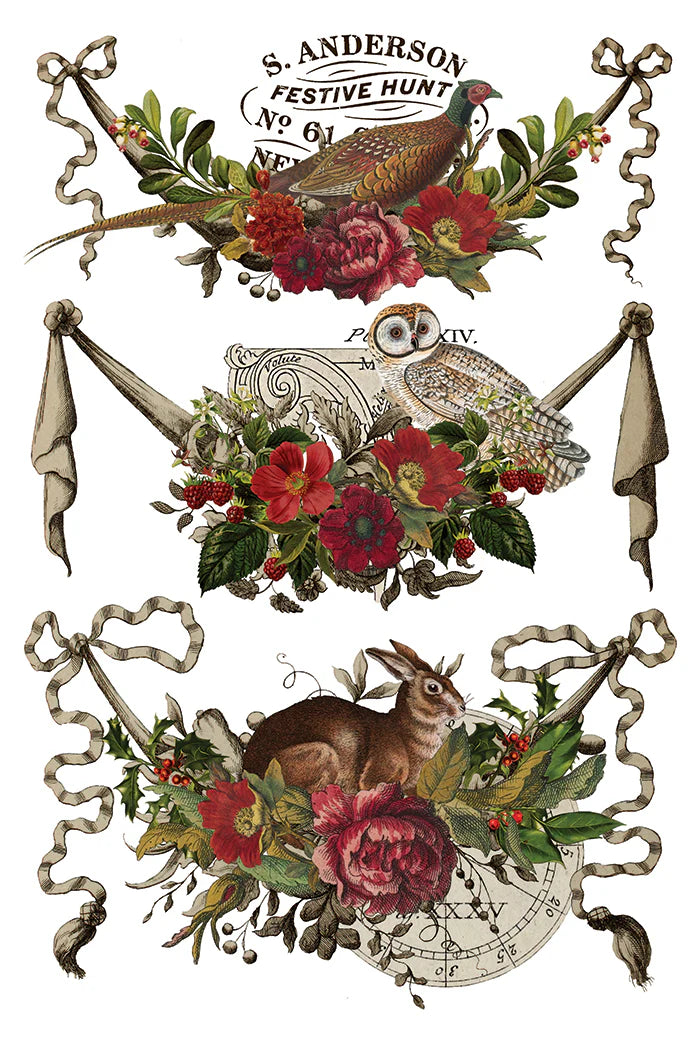 Rub on transfer sheet displaying three vintage-style hunting illustrations arranged vertically on a white background, each featuring a bird (pheasant, owl, rabbit), red flowers, green leaves, and ribbon banners. The top design includes the text 'S.