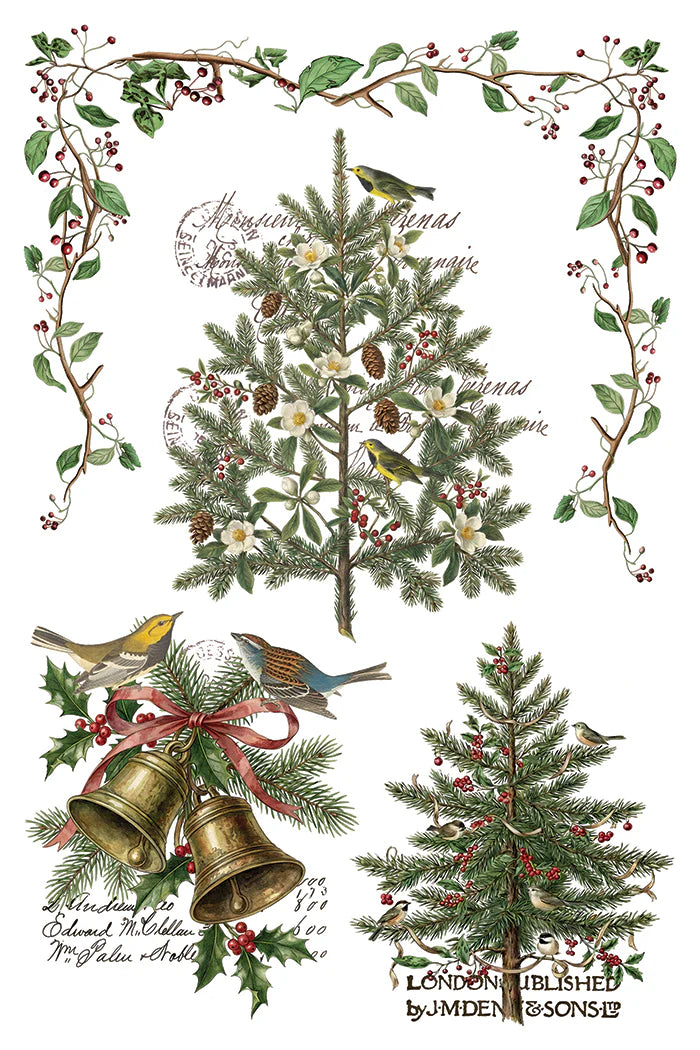 A rub on transfer sheet with vintage-style Christmas illustration sheet featuring two evergreen trees, two birds, two brass bells with a red ribbon, holly leaves, berries, and a decorative border of branches and leaves on a white background with cursive text.