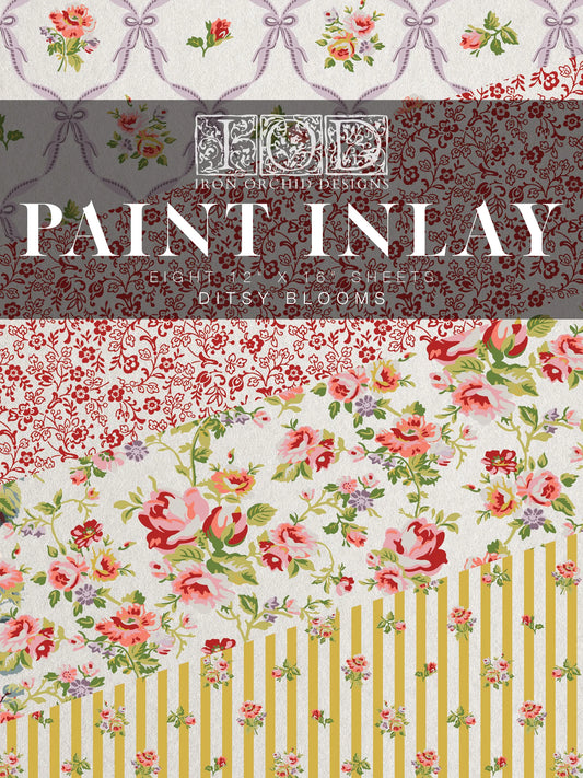 A pad of IOD Paint Inlay with floral patterns including roses and ribbons, labeled 'Ditsy Blooms'.