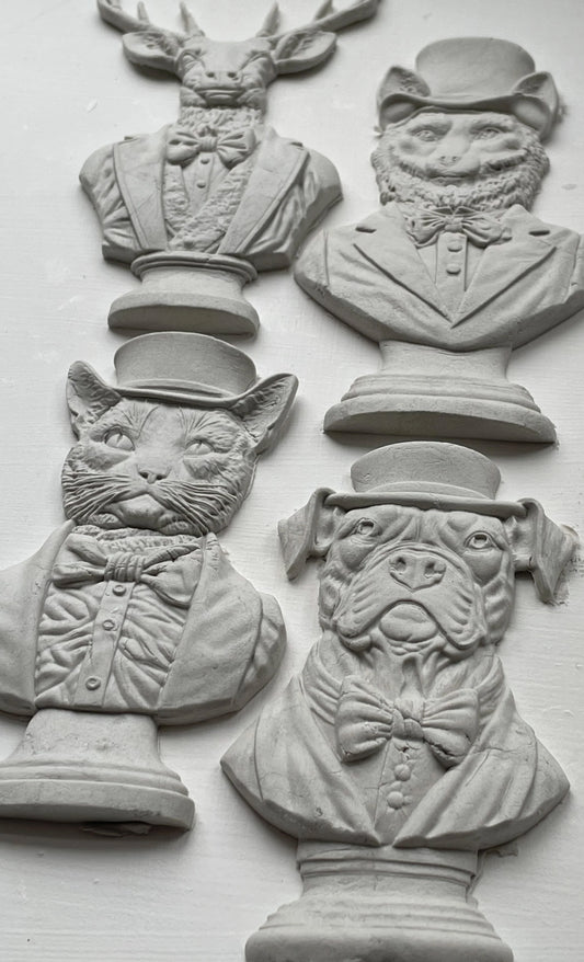 Clay castings of four different animals busts, made from the IOD mould 'Invitation Only'.