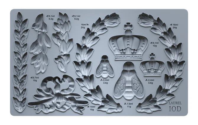 Silicone mold with floral and crown designs on a gray background