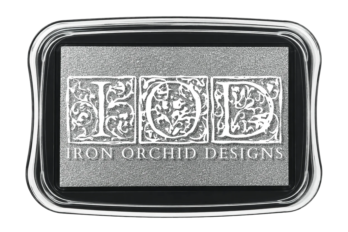 A rectangular ink pads in silver pigment with the words "Iron Orchid Designs" on the lid