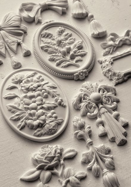 Decorative clay castings with floral and leaf patterns from the Victoriana mold