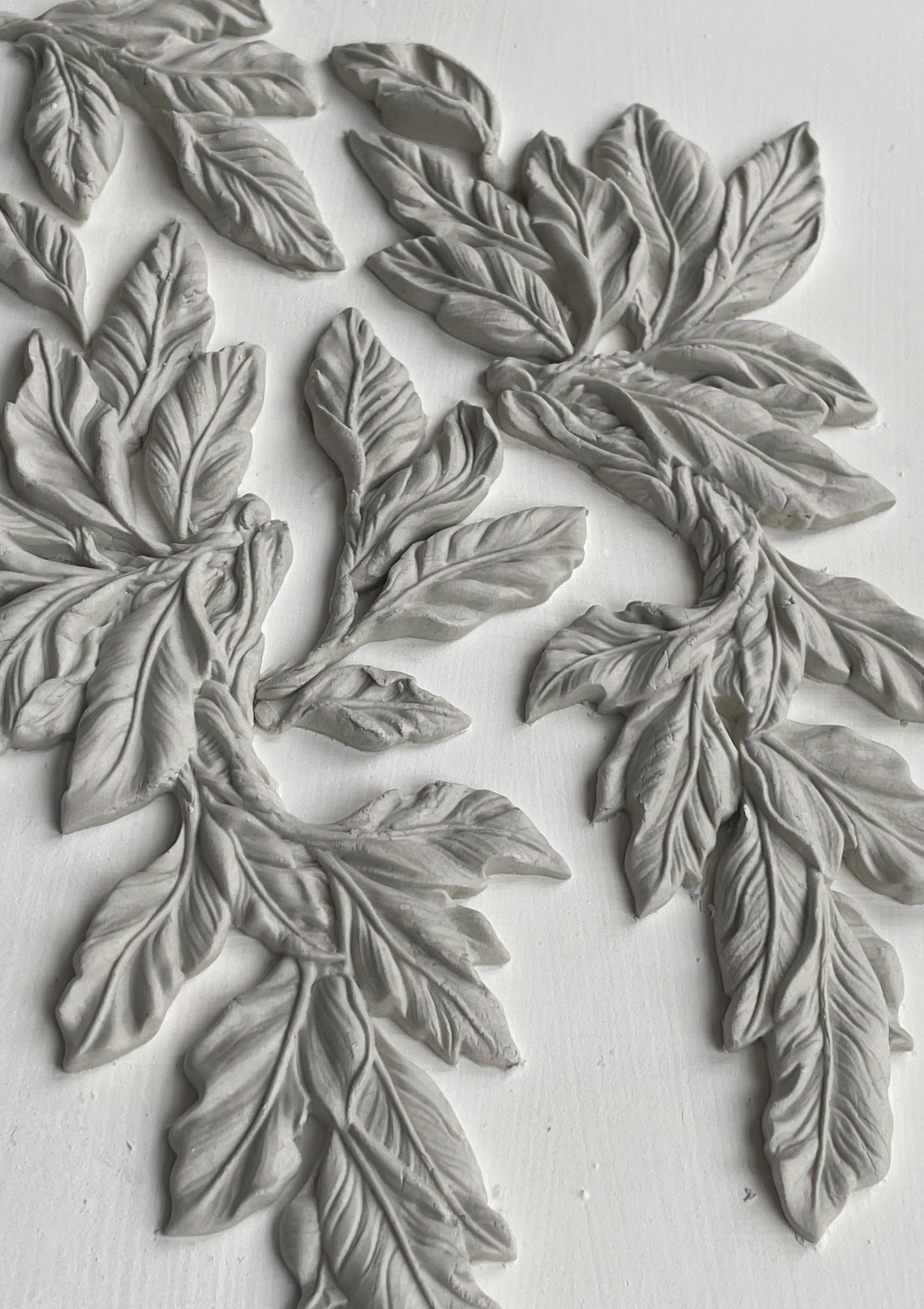 Clay castings of greenery from an IOD mould