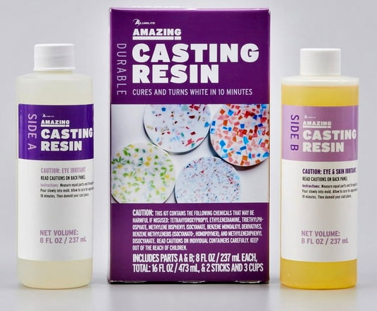 Two bottles of Amazing Casting Resin with a purple label, showing the product in a clear and opaque white state, alongside its packaging box.