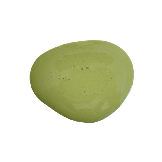 Dollop of green milk paint in the shade Artichoke, splattered on a white background.