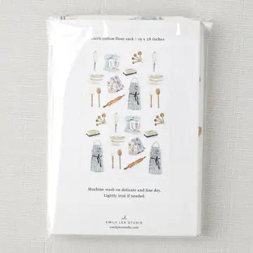 Packaged product with illustrations of kitchen items on a textured fabric background