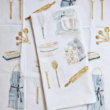 Kitchen towel with illustrations of baking utensils and culinary supplies on a white background