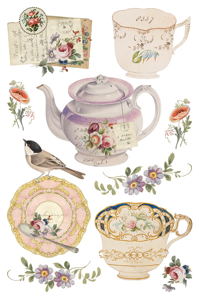 Transfer sheet showing a collection of vintage-style teacups, teapot, and floral elements on a white background