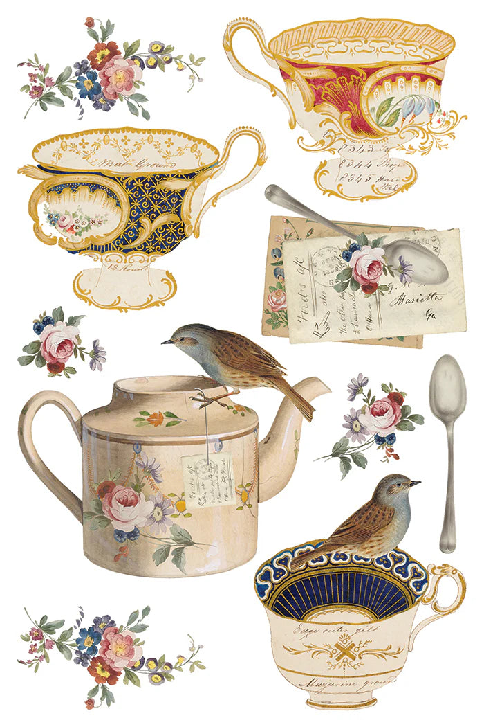 Transfer sheet of a collection of vintage-style teacups, teapots, and floral elements on a white background