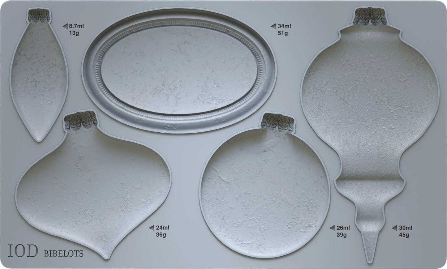 A gray silicone mould featuring ornaments  of various sizes. Mould has labels indicating the brand 'IOD' and the word 'BIBELOTS'.