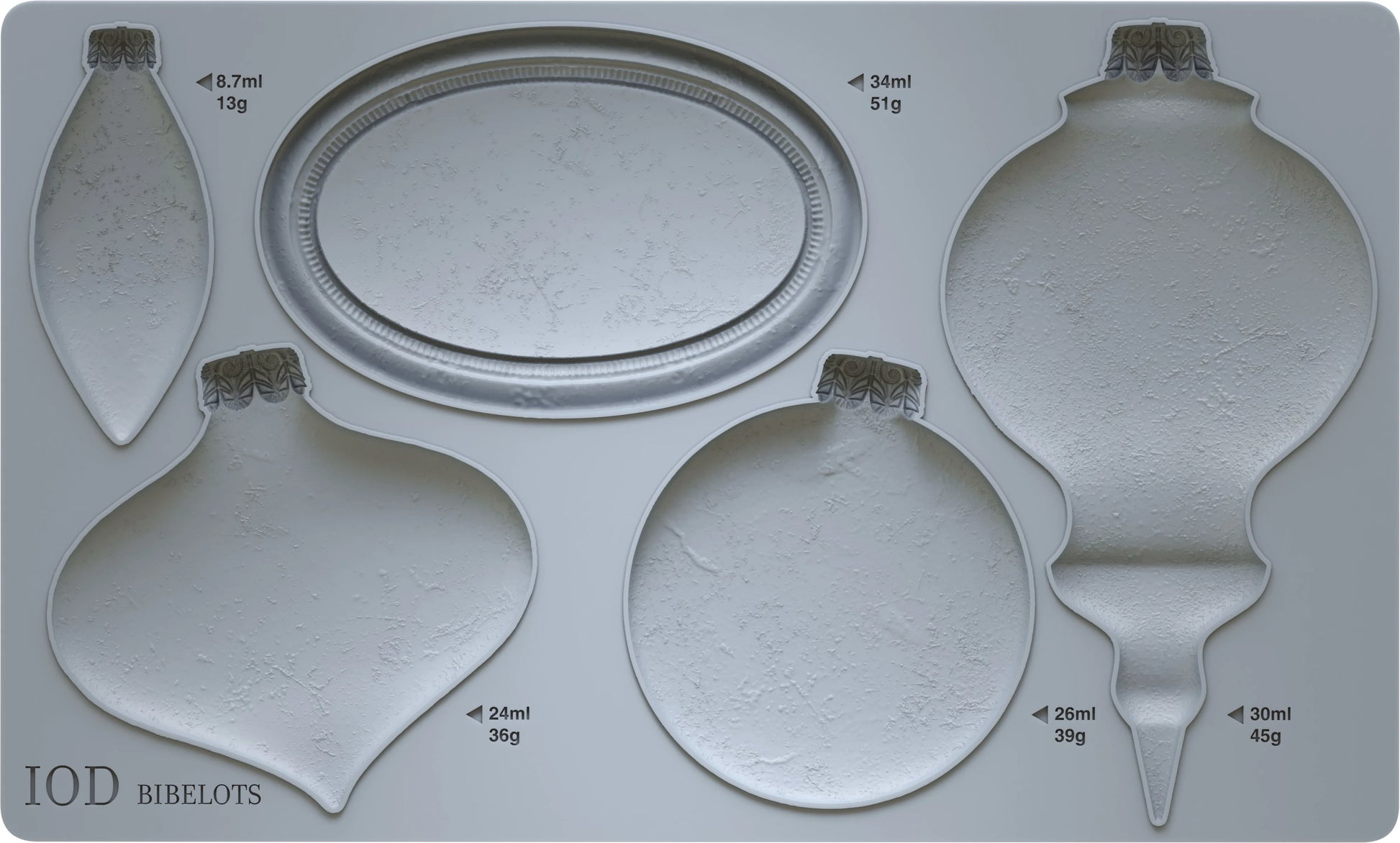 A gray silicone mould featuring ornaments  of various sizes. Mould has labels indicating the brand 'IOD' and the word 'BIBELOTS'.