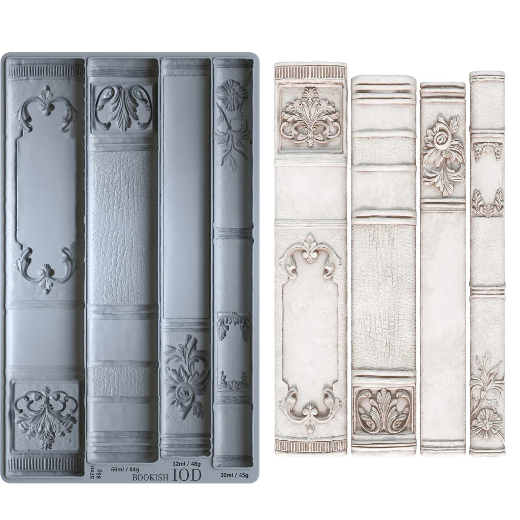 A decorative book-shaped mold with intricate designs on a white background, and four example castings made of air dry clay