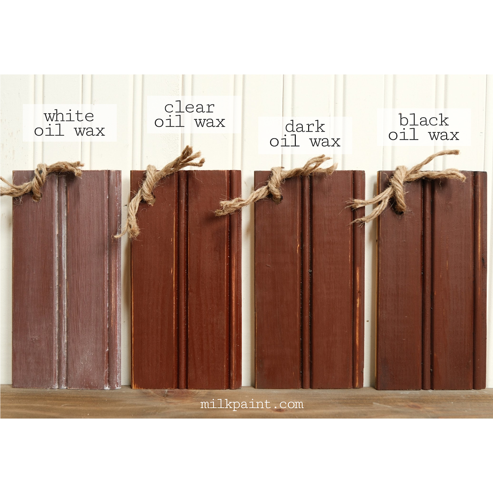 Four wooden planks in the color Cherry Pie, each with different oil wax finishes on a white background.