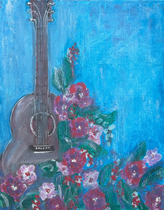 An expressive painting of an acoustic guitar in dark gray tones, surrounded by vibrant pink, purple, and red flowers with green leaves against a bright textured blue background.