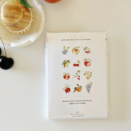 Packaged product with fruit illustrations on a white surface