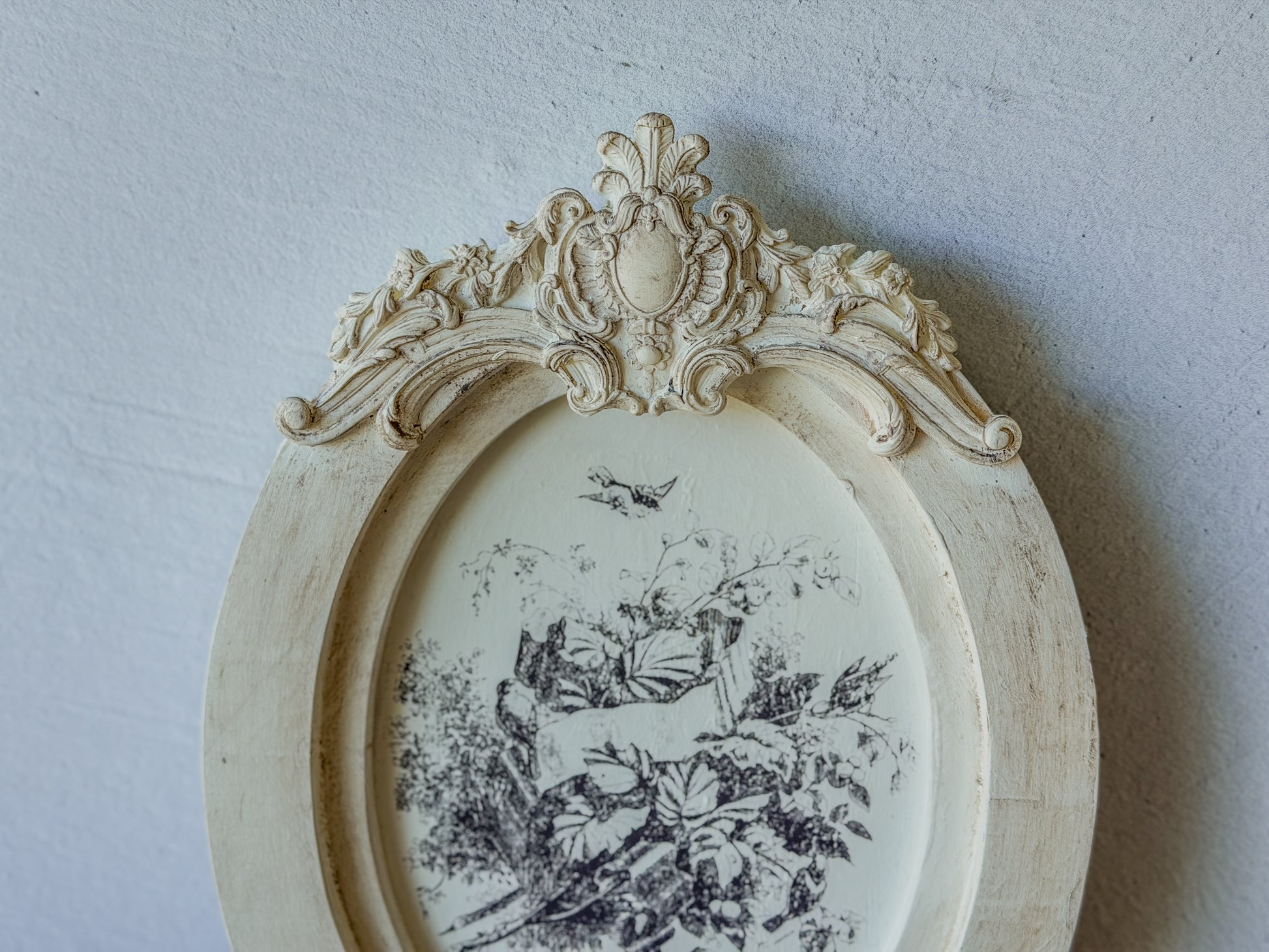 Clay casting of frame border from Cadré mould, attached to an IOD wood blank, stamped with botanical elements.